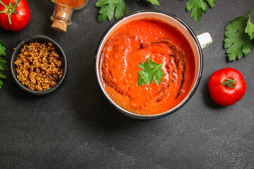 gazpacho, tomato or carrot soup with vegetables (delicious feather dish, healthy cooking) menu concept. food background. copy space. Top view