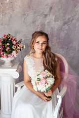 The girl in a wedding dress. The bride is beautiful. Fashion photo shoot of a wedding dress. Wedding Dress.