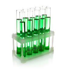 Test tubes with green liquid on white background
