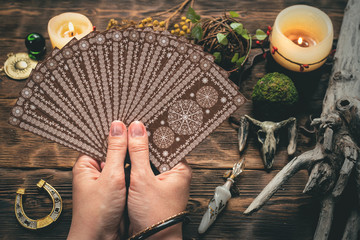 Fortune teller woman reading a future by tarot cards concept.