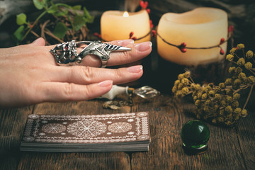 Fortune teller woman reading a future by tarot cards concept.