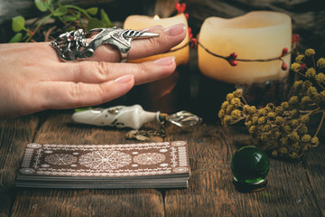 Fortune teller woman reading a future by tarot cards concept.