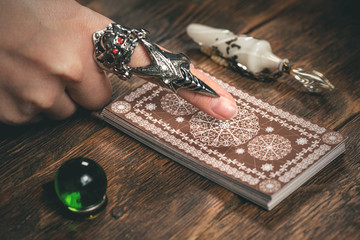 Fortune teller woman reading a future by tarot cards concept.