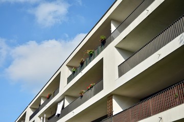 Modern apartment buildings on a sunny day with a blue sky. Facade of a modern apartment building