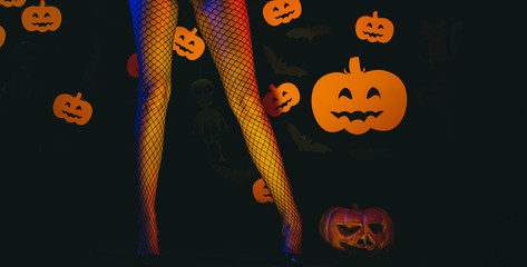 Sexy Model Posing In Lingerie on halloween background. Autumn time for Fashion sale. Woman shows a...