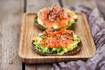 Smoked salmon, scrambled eggs and avocado  rye crisp toast