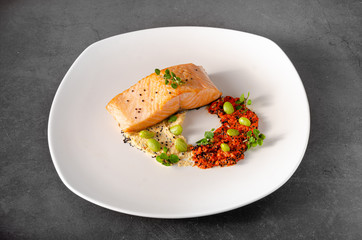 Grilled salmon with pepper hummus with quinoa