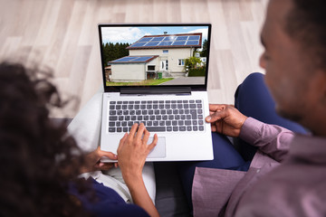 Couple Looking At New House