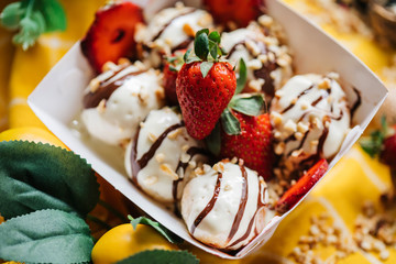 turkish loam. turkish bite dessert with chocolate and white chocolate sauce. strawberry and banana new generation bite