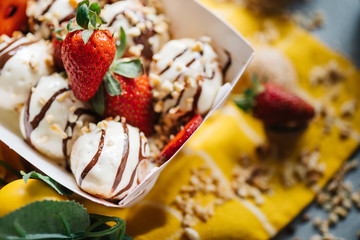 turkish loam. turkish bite dessert with chocolate and white chocolate sauce. strawberry and banana new generation bite
