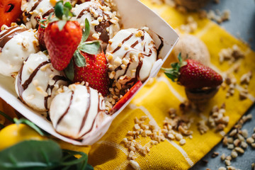 turkish loam. turkish bite dessert with chocolate and white chocolate sauce. strawberry and banana new generation bite