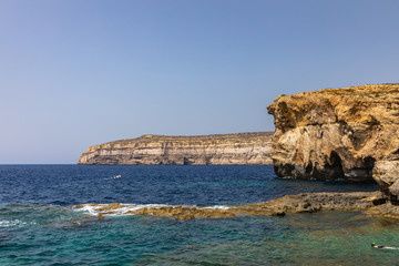 Fototapeta na wymiar Stunning view at the coast of Dwejra Bay with the ruin of Azure Window on Gozo island in Malta