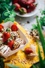 turkish loam. turkish bite dessert with chocolate and white chocolate sauce. strawberry and banana new generation bite