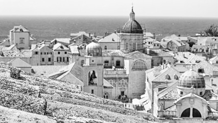 Mediterranean cityscape in black-and-white color - view of the old roof on the background of the Old Town of Dubrovnik on the Adriatic coast of Croatia, closeup
