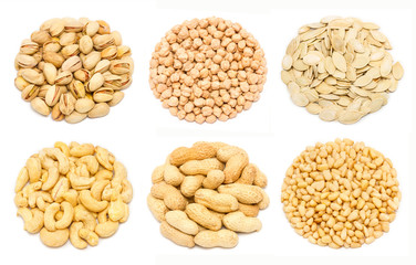 Set of nuts - pistachio nuts in the shell, chickpea seeds without shell, pumpkin seeds in the shell, raw cashew seeds without shell, peanut in the shell, pine nut kernels, isolated on white background