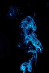Fototapeta premium Blue abstract smoke on black background