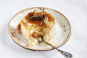 Baked Camembert cheese with fig jam and fresh figs, copy space
