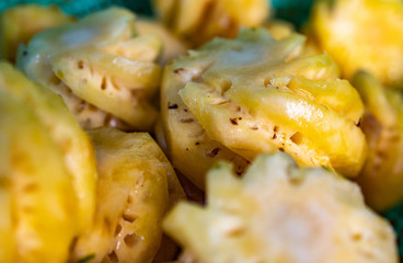A group of fresh small size pineapple fruits at Thai Market