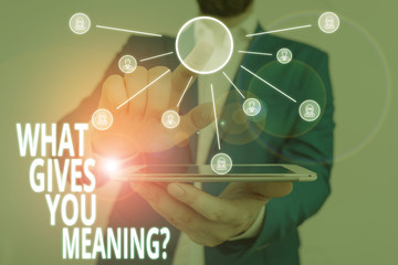 Word writing text What Gives You Meaning Question. Business photo showcasing your purpose or intentions in life Male human wear formal work suit presenting presentation using smart device