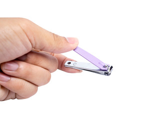 The man's hand with a purple manicure knife isolated from a white background