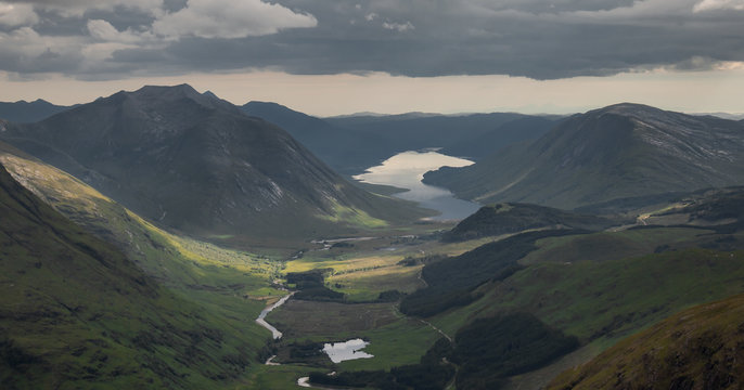 View of the valley of Glen Etive from the Stob Dubh peak, summit of the Buachaille Etive Beag, with Loch Etive in the background. Highlands of Scotland. Munro bagging. Hiking. Hill Walking.