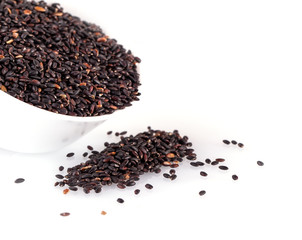 brown rice in a Cup isolated on white