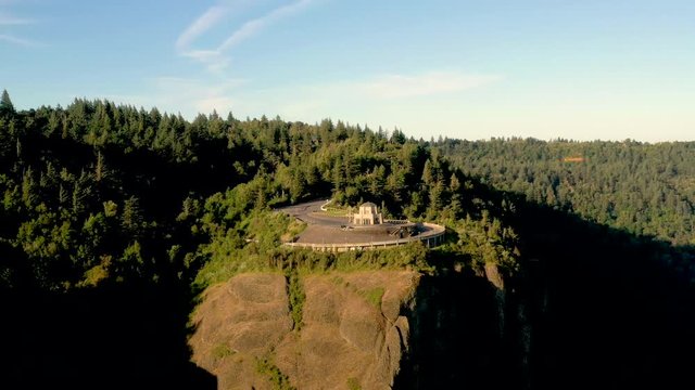 Cinematic aerial drone flying at sunrise Crown Point Vista house near Portland Oregon