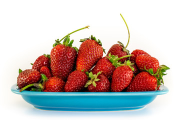 Strawberries in a bowl isolated on white background, side view