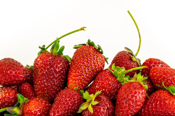 Heap of fresh strawberries on white background with copy space