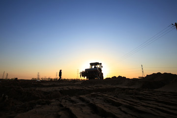 Fototapeta premium The tractor in farmland farming