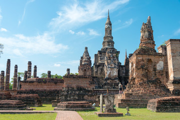 Fototapeta na wymiar Sukhothai, Thailand - Apr 08 2018: Wat Mahathat in Sukhothai Historical Park, Sukhothai, Thailand. It is part of the World Heritage Site - Historic Town of Sukhothai and Associated Historic Towns.