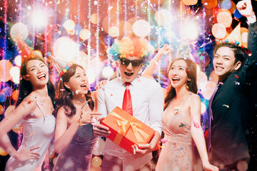 happy young group enjoy birthday party in night club