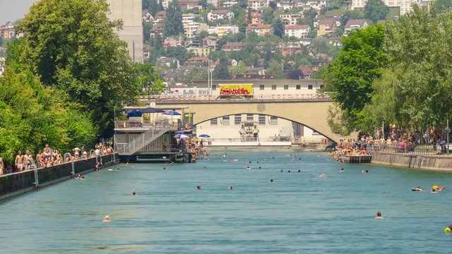 sunny day zurich city center river summer fun swimming people bridge panorama 4k timelapse switzerland