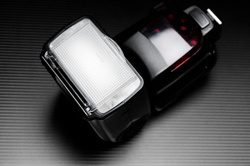 External flash lamp for dslr camera on the dark background. 