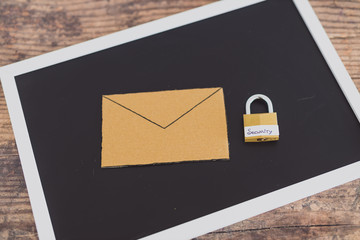 user privacy concept, email envelope miniature on desk with lock labelled security on it