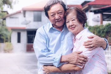 Obraz premium Happy elderly couple with lifestyle after retiree concept. Lovely asian seniors couple embracing together .