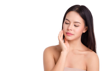 asian young beautiful woman smiling and touching her face, isolated over white background. natural makeup, SPA therapy, skincare, cosmetology and plastic surgery concept