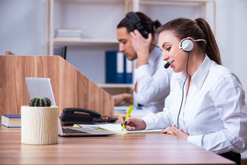 Call center operators working in the office
