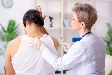 Young patient visiting doctor in hospital