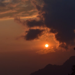 Mountain landscape at sunset at Bhutan Mountain. Amazing view on colorful clouds and layered mountains.