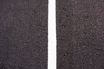 white line on asphalt close up