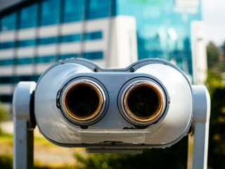 Binoculars on the city observation deck for tourists. Sightseeing with binoculars