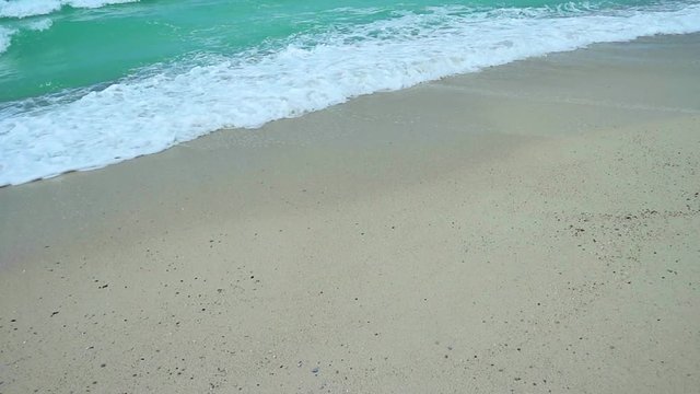 Natural splashing wave sea sand beach on sunny day at the island.