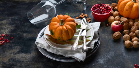 Autumn table setting with pumpkins