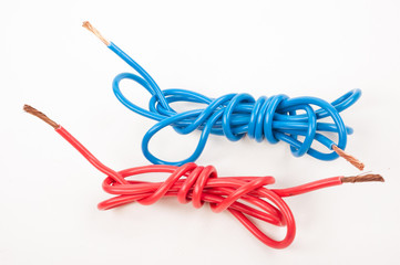 Blue and red electric wire on white background