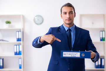 Young male accountant working in the office