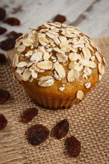 Fresh muffin with oatmeal baked with wholemeal flour and raisins, delicious healthy dessert