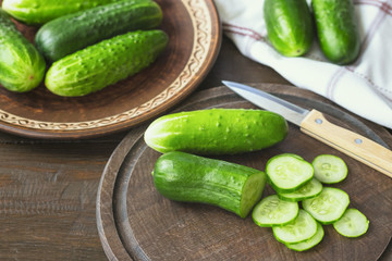 fresh cucumbers, sliced on a chopping board. salad ingredients. fresh cucumbers on the table closeup.