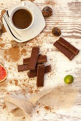 cup of coffee and cookies on wooden table