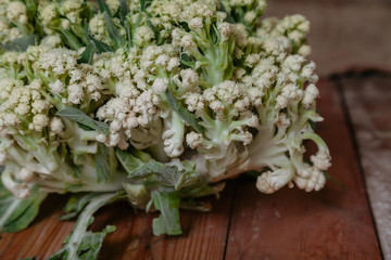 Cauliflower lies on planed boards